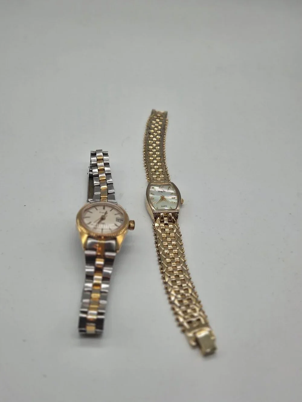 Pair of goldtone watches